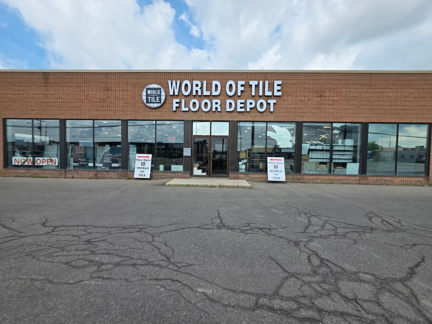 World of Tile store front with 'Floor Depot' branding on a cloudy day. Contact World of Tile St Catharines, a reliable tile store near me for flooring, tiles, and bathroom fixtures